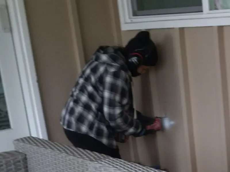 Professional electrician installing an exterior outlet in Columbus